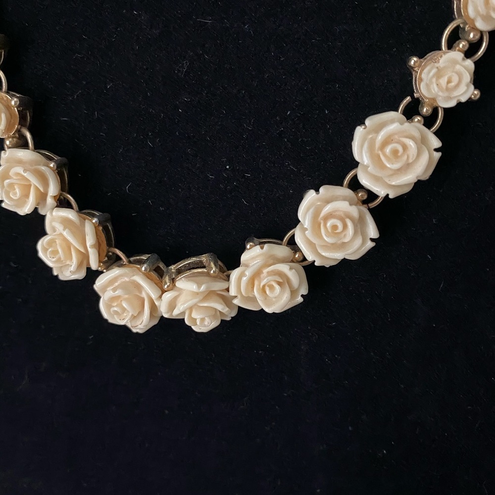 Set of two floral necklaces.